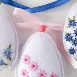 Osterei mit Gänseblümchen Filzdekoration